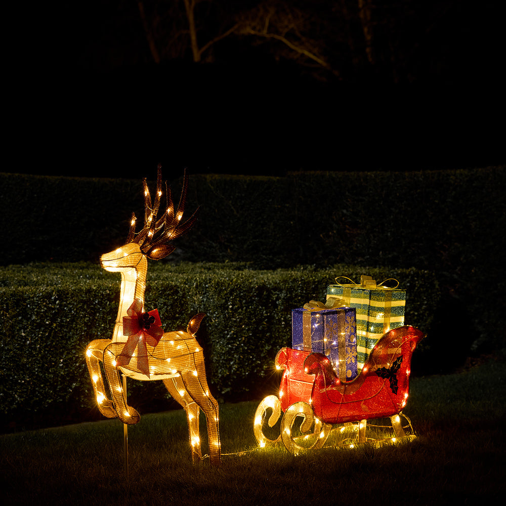 Galoppierendes LED Rentier mit Schlitten voller Geschenke